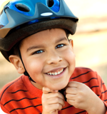 a child wearing a bike helmet
